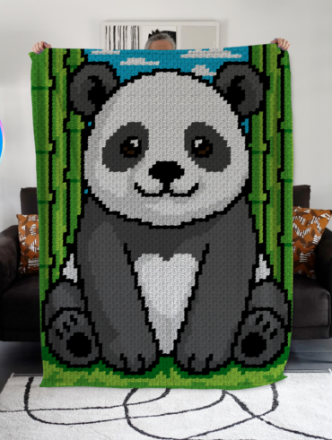Panda – patron de couverture C2C au crochet d'un panda mignon entouré de bambous, avec des couleurs noir, blanc et verts.